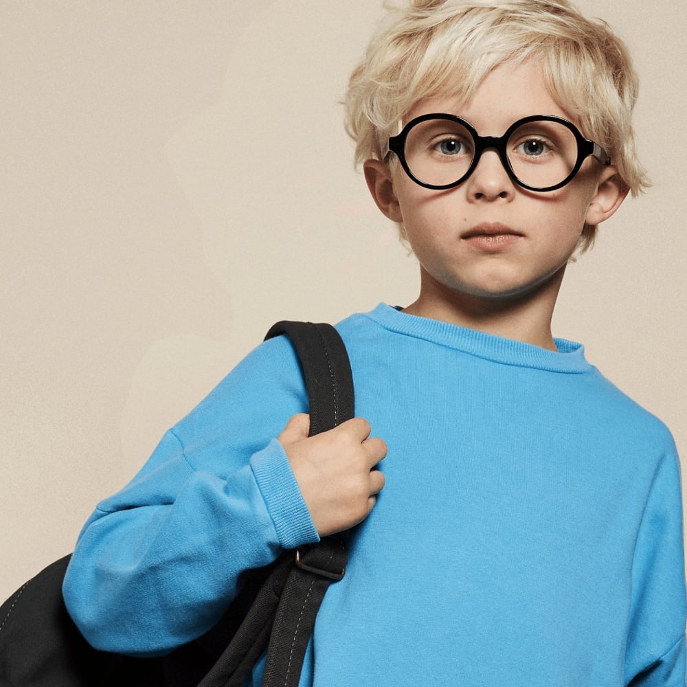 Child with JR&JR round glasses | Code